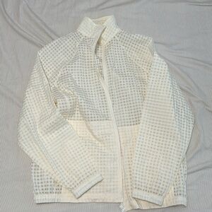 Never worn Fabletics zip up. Off white checkered. Size L